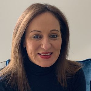 Image of a woman with long brown hair looking at the camera.