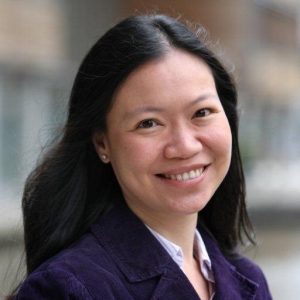 Image of a woman with long black hair smiling at the camera.