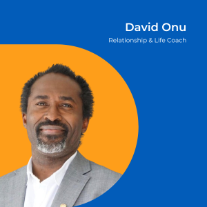 Image of a man with short spikey hair wearing a grey jacket with white shirt. Background is orange.