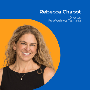 Image of a woman with long curly blonde hair, wearing a black top, against an orange background.