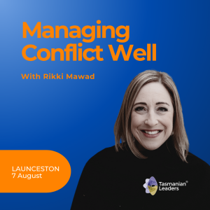 Managing Conflict Well promotional slide has a blue background with orange text and a photo of Rikki Mawad. She smiles directly at the camera and wears a black roll necked jumper with short straight shoulder length hair.