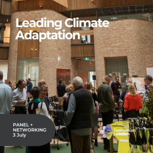 Image of participants of the Leadership Summit networking in the Rivers Edge Building at UTAS. they are all talking amongst themselves many are smiling . Tall internal brick walls are the back drop.