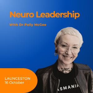 image of a smiling Polly McGee with short blonde hair, glasses, black leather jacket and Tasmania t-shirt. on blue background with orange text.