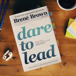 Brene Brown's book Dare to Lead, lying flat on a table top. Image taken as a flat lay