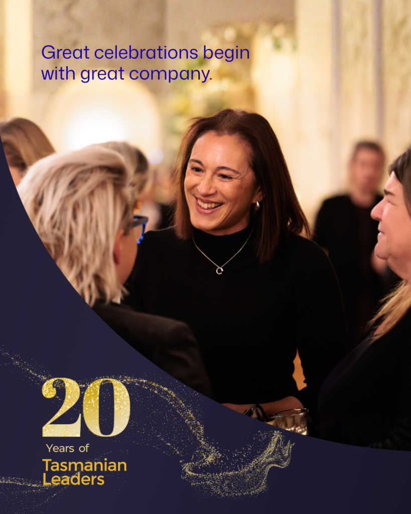 A woman smiles and talks with other guests at a warmly lit Tasmanian Leaders event. Text reads “Great celebrations begin with great company” alongside a graphic marking 20 years of Tasmanian Leaders.