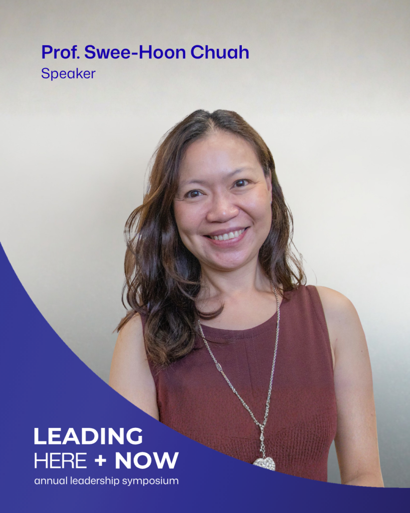 Professor Swee-Hoon Chuah smiling at the camera, wearing a sleeveless burgundy top and long pendant necklace. The graphic identifies her as a speaker at Leading Here + Now.