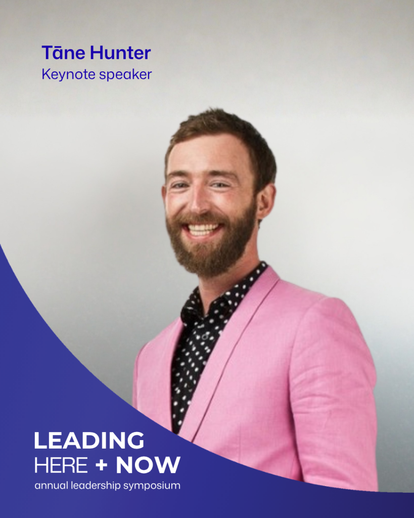Tāne Hunter smiling, wearing a bright pink jacket over a black patterned shirt. The graphic identifies him as a keynote speaker at Leading Here + Now.